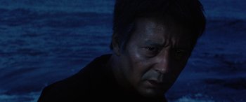 Movie still from “Lady Snowblood” (1973), directed by Toshiya Fujita – A person looking at the camera; Close Up shot, Low angle