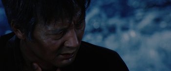 Movie still from “Lady Snowblood” (1973), directed by Toshiya Fujita – A person with his eyes closed; Close Up shot, Low angle