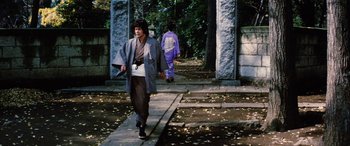 Movie still from “Lady Snowblood” (1973), directed by Toshiya Fujita – A man walking down the street wearing a kimono; Wide shot, Low angle