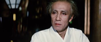 Movie still from “Lady Snowblood” (1973), directed by Toshiya Fujita – A person wearing a white robe; Close Up shot, Low angle