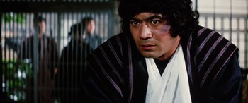Movie still from “Lady Snowblood” (1973), directed by Toshiya Fujita – A person wearing a robe; Close Up shot, Low angle