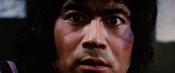 Movie still from “Lady Snowblood” (1973), directed by Toshiya Fujita – A person's eyes and face; Extreme Close Up shot, Low angle