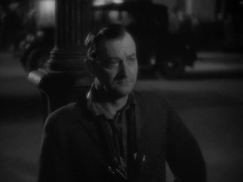 Movie still from “Lady for a Day” (1933), directed by Frank Capra – A black - and - white photo of a man in a suit; Close Up shot, High angle