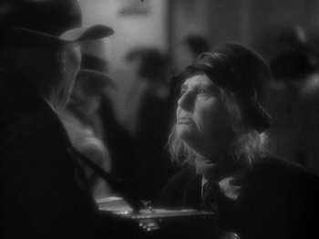 Movie still from “Lady for a Day” (1933), directed by Frank Capra – An old man and a woman sitting at a table; Close Up shot, Over the shoulder angle
