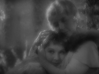 Movie still from “Lady for a Day” (1933), directed by Frank Capra – A woman hugging another woman in a black and white photo; Close Up shot, High angle