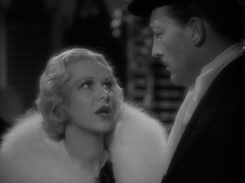 Movie still from “Lady for a Day” (1933), directed by Frank Capra – A man and a woman are standing next to each other; Close Up shot, Over the shoulder angle