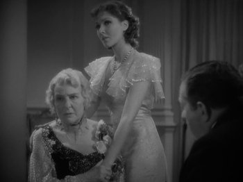 Movie still from “Lady for a Day” (1933), directed by Frank Capra – Two women and a man in formal dress; Medium shot, Over the shoulder angle