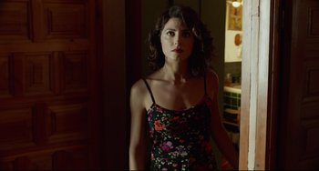 Movie still from “Everybody Knows” (2018), directed by Asghar Farhadi – A woman standing in a room with her mouth open; Medium shot, Over the shoulder angle