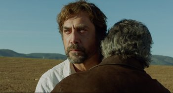 Movie still from “Everybody Knows” (2018), directed by Asghar Farhadi – A person standing next to another person; Close Up shot, Over the shoulder angle