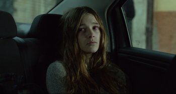 Movie still from “Everybody Knows” (2018), directed by Asghar Farhadi – A woman sitting in the back seat of a car; Close Up shot, Over the shoulder angle