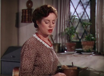 Movie still from “Lassie Come Home” (1943), directed by Fred M. Wilcox – A woman standing in front of a pot on a stove; Close Up shot, Low angle