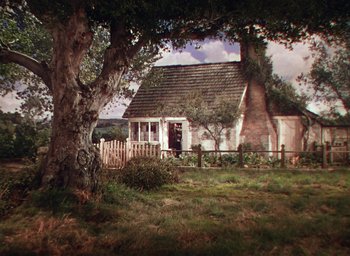 Movie still from “Lassie Come Home” (1943), directed by Fred M. Wilcox – An image of an old house in the middle of the day; Extreme Wide shot, High angle