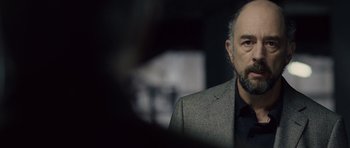 Movie still from “Last Chance Harvey” (2008), directed by Joel Hopkins – A person wearing a suit and tie; Close Up shot, Over the shoulder angle