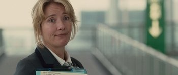 Movie still from “Last Chance Harvey” (2008), directed by Joel Hopkins – A woman holding a folder in her hands; Close Up shot, Over the shoulder angle