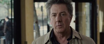 Movie still from “Last Chance Harvey” (2008), directed by Joel Hopkins – An older man with grey hair looking at the camera; Close Up shot, Over the shoulder angle