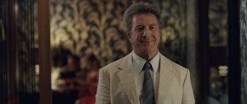 Movie still from “Last Chance Harvey” (2008), directed by Joel Hopkins – A person wearing a suit and tie; Close Up shot, Over the shoulder angle