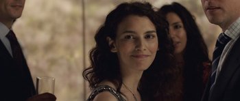 Movie still from “Last Chance Harvey” (2008), directed by Joel Hopkins – A person with curly hair smiling; Close Up shot, Over the shoulder angle