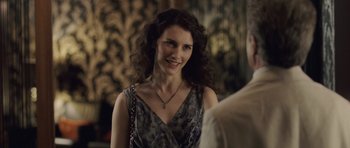 Movie still from “Last Chance Harvey” (2008), directed by Joel Hopkins – A beautiful woman with long curly hair wearing a dress; Close Up shot, Over the shoulder angle