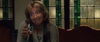 Movie still from “Last Chance Harvey” (2008), directed by Joel Hopkins – A woman holding a wine glass in her right hand; Close Up shot, Over the shoulder angle