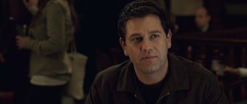 Movie still from “Last Chance Harvey” (2008), directed by Joel Hopkins – A person sitting in a room; Close Up shot, Over the shoulder angle