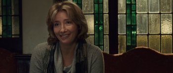 Movie still from “Last Chance Harvey” (2008), directed by Joel Hopkins – A woman sitting in front of a stained glass window; Close Up shot, Over the shoulder angle