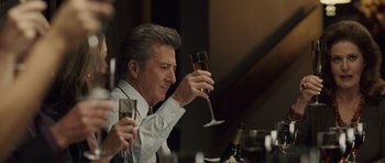 Movie still from “Last Chance Harvey” (2008), directed by Joel Hopkins – A man sitting at a table holding a glass of wine; Close Up shot, Over the shoulder angle