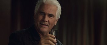Movie still from “Last Chance Harvey” (2008), directed by Joel Hopkins – An older man holding a wine glass in his hand; Close Up shot, Over the shoulder angle