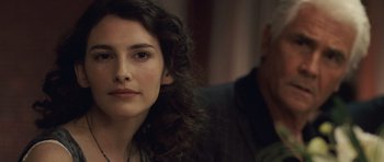 Movie still from “Last Chance Harvey” (2008), directed by Joel Hopkins – A person with curly brown hair; Close Up shot, Over the shoulder angle