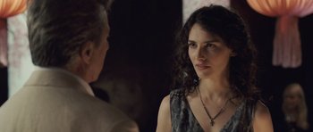 Movie still from “Last Chance Harvey” (2008), directed by Joel Hopkins – A woman in a grey dress talking to a man in a black suit; Close Up shot, Over the shoulder angle