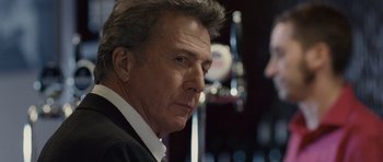 Movie still from “Last Chance Harvey” (2008), directed by Joel Hopkins – An older man wearing a suit and tie looking at the camera; Close Up shot, Over the shoulder angle