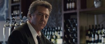 Movie still from “Last Chance Harvey” (2008), directed by Joel Hopkins – A person wearing a suit and tie; Close Up shot, Over the shoulder angle