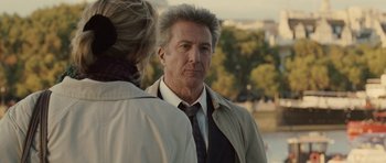 Movie still from “Last Chance Harvey” (2008), directed by Joel Hopkins – A man and a woman standing next to each other in front of a river; Close Up shot, Over the shoulder angle