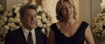 Movie still from “Last Chance Harvey” (2008), directed by Joel Hopkins – A man and a woman standing next to each other in front of flowers; Close Up shot, Over the shoulder angle