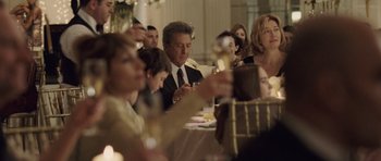 Movie still from “Last Chance Harvey” (2008), directed by Joel Hopkins – A group of people sitting at a table with wine glasses; Medium shot, Over the shoulder angle