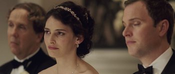 Movie still from “Last Chance Harvey” (2008), directed by Joel Hopkins – A woman wearing a tiara looking at a man in front of a mirror; Close Up shot, Over the shoulder angle
