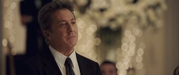 Movie still from “Last Chance Harvey” (2008), directed by Joel Hopkins – A person wearing a suit and tie; Close Up shot, Over the shoulder angle