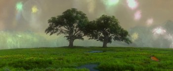 Movie still from “Last Days in the Desert” (2015), directed by Rodrigo García – Two large trees in a grassy field with a sky background; Extreme Wide shot, Low angle