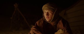 Movie still from “Last Days in the Desert” (2015), directed by Rodrigo García – A man with a turban is looking at the camera; Close Up shot, Low angle