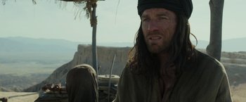 Movie still from “Last Days in the Desert” (2015), directed by Rodrigo García – A person with long brown hair; Close Up shot, Over the shoulder angle