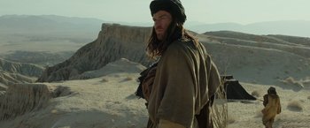 Movie still from “Last Days in the Desert” (2015), directed by Rodrigo García – A man with a long beard and a hat on; Medium shot, Low angle