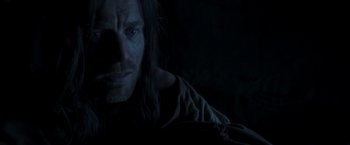 Movie still from “Last Days in the Desert” (2015), directed by Rodrigo García – A person with long black hair; Close Up shot, Low angle