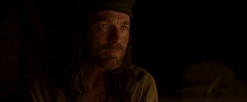 Movie still from “Last Days in the Desert” (2015), directed by Rodrigo García – A person with long hair and a beard; Close Up shot, Over the shoulder angle