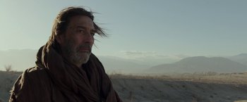 Movie still from “Last Days in the Desert” (2015), directed by Rodrigo García – A man with long hair and a beard in the desert; Close Up shot, Low angle