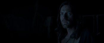 Movie still from “Last Days in the Desert” (2015), directed by Rodrigo García – A person with long black hair; Close Up shot, Over the shoulder angle