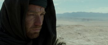 Movie still from “Last Days in the Desert” (2015), directed by Rodrigo García – A person wearing a headscarf; Close Up shot, Over the shoulder angle