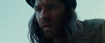 Movie still from “Last Days in the Desert” (2015), directed by Rodrigo García – A person with long hair and a beard; Close Up shot, Low angle