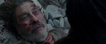 Movie still from “Last Days in the Desert” (2015), directed by Rodrigo García – A person laying on the ground covered in blood; Close Up shot, Overhead angle