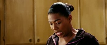 Movie still from “Last Holiday” (2006), directed by Wayne Wang – A person wearing a jacket; Close Up shot, Over the shoulder angle