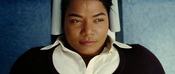 Movie still from “Last Holiday” (2006), directed by Wayne Wang – A man with a white shirt and a black shirt on; Close Up shot, Overhead angle