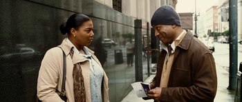 Movie still from “Last Holiday” (2006), directed by Wayne Wang – A man and a woman talking on the sidewalk; Medium shot, Over the shoulder angle